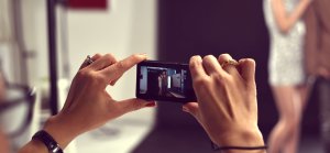 Woman taking a photo in a studio